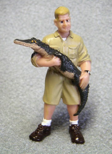 Alligator or Crocodile Handler Small Plastic Figurine (Man holding crocodile, looks like Steve Irwin)