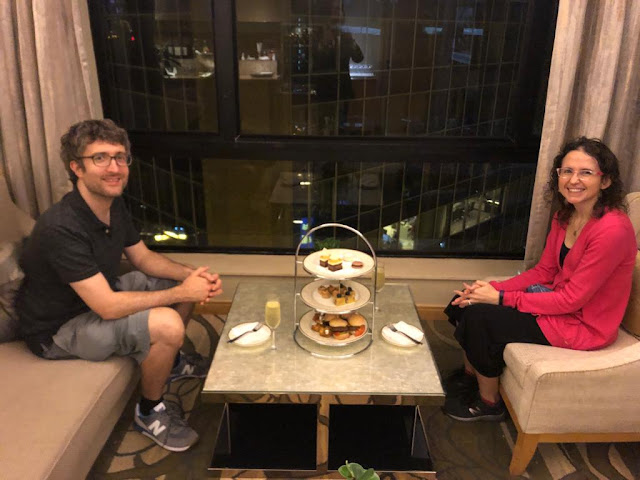 Sydney and David with a three-tier tower of hor d'oeuvres