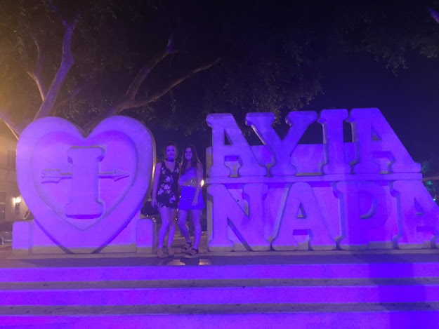 two girls at the Ayia Napa signs