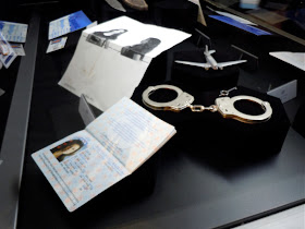 Kate handcuffs and passport LOST props