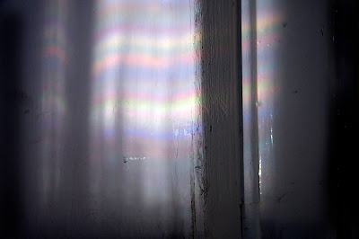 coloured light patterns on a white wall