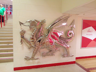 Silver dragon on wall to welcome visitors to the stadium