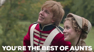 A period drama where a young man in soldier's uniform kisses the hand of a woman in formal dress. The caption says, 'You're the best of aunts.'