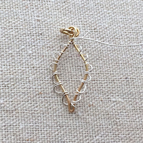 Learn to make this wire leaf with scallop edge - from a free tutorial at Lisa Yang's Jewelry Blog