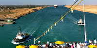 The crowded Suez Canal is a likely checkpoint for the world food trade. (Image Credit: By panoramio.com/user/2433337?with_photo_id=64163879, via Wikimedia Commons) Click to Enlarge.