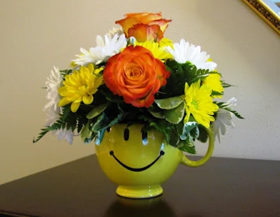 happy face floral arrangement monica curry