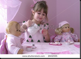 stock-photo-a-young-girl-having-a-tea-party-with-her-baby-dolls-2602595