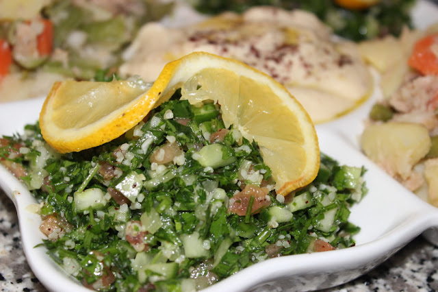 Arabic Tabouleh Salad in a Platter Decorated by Lemon slice