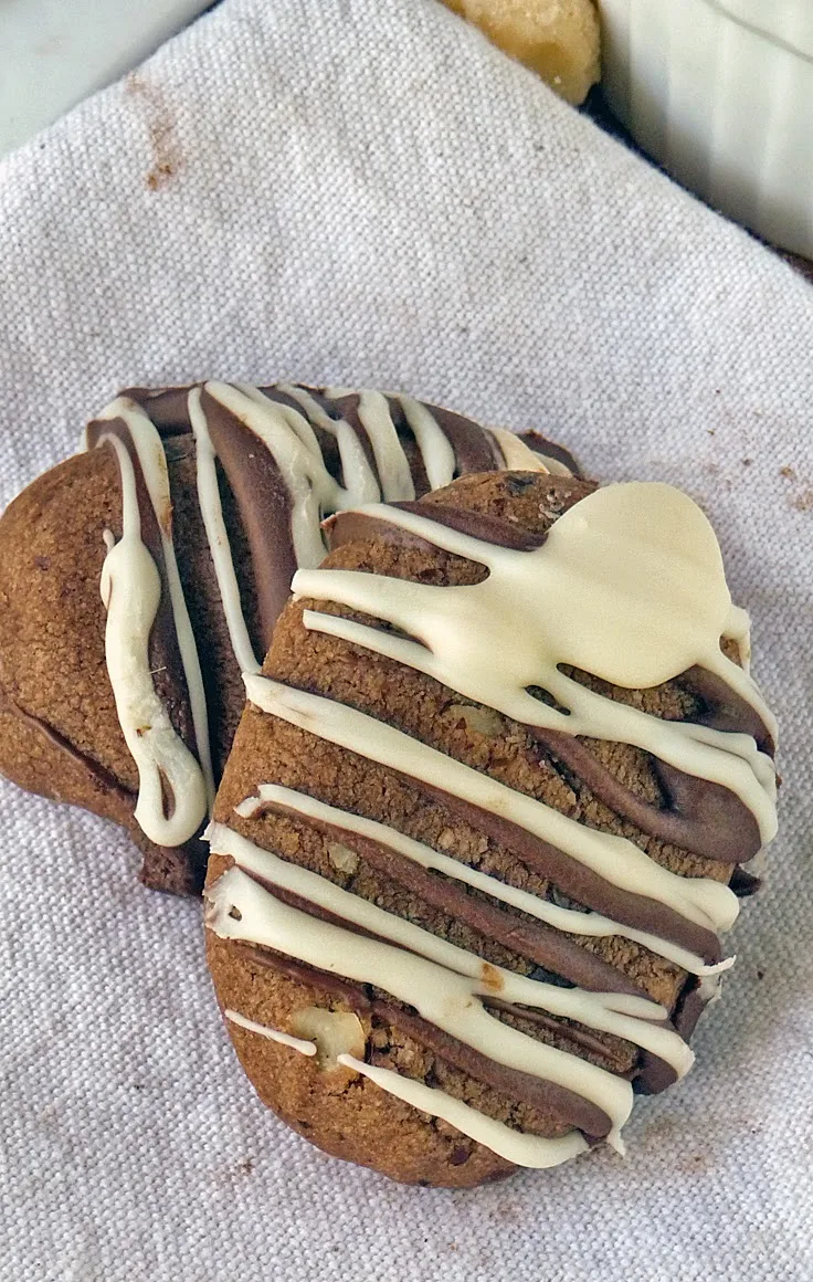 Double Chocolate Macadamia Nut Cookies | by Life Tastes Good are rich chocolate oval cookies packed full of salty macadamia nuts and drizzled in semi-sweet and creamy white chocolate!