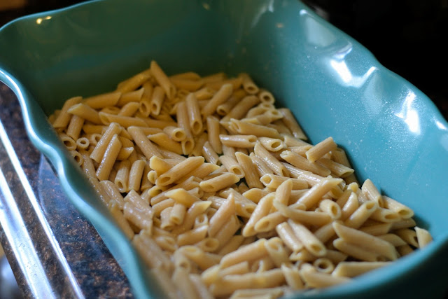 The fully cooked pasta in a greased baking dish.  