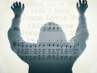 person in praise,  hands raised, music superimposed