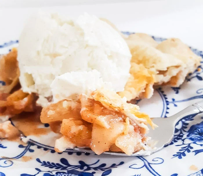 apple pie, vanilla ice cream, blue and white floral plate