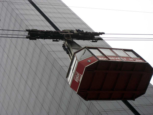 Tram Work - A man works above one of the old Roosevelt Island Tram cars; from the Queensboro Bridge.