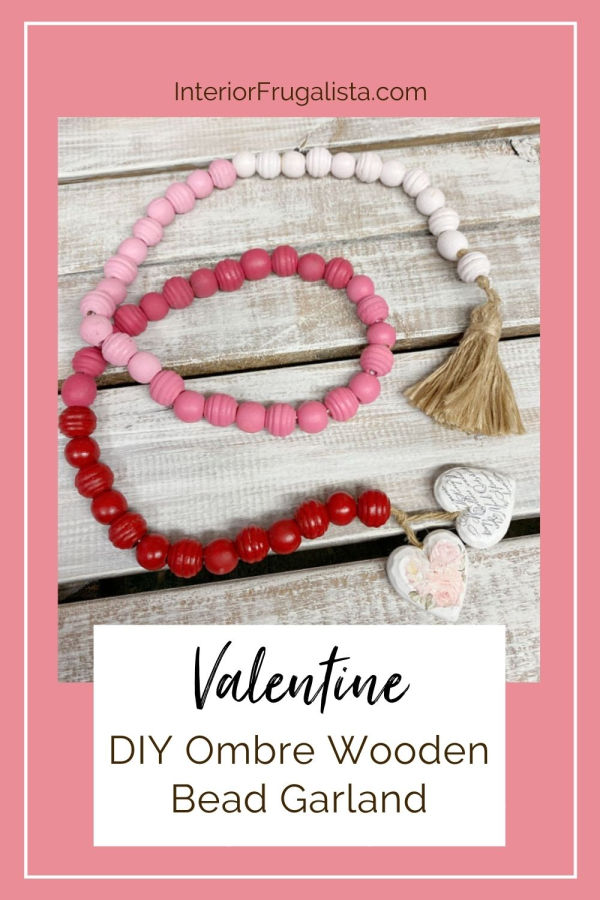 A string of natural wooden beads with tassels is so popular for farmhouse decor these days. When I saw a container of assorted beads at the dollar store I decided it's time I finally make one, but with a twist. Instead, I made an Ombre DIY Wooden Bead Garland for Valentine's Day painted gradient pink. #valentinesdaydecor #valentinedecor #garland #farmhouse