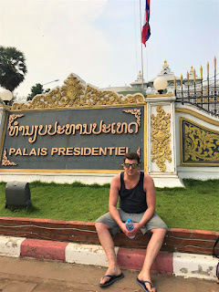 James posing outside Vientiane's palace.