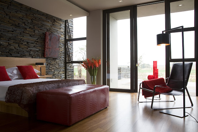Modern bedroom with red furniture 