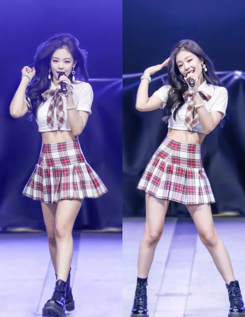 Jennie wears a plaid pleated skirt.