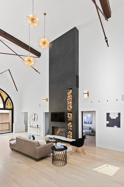 Fireplace in moern living room in Church conversion to chic private home Chicago