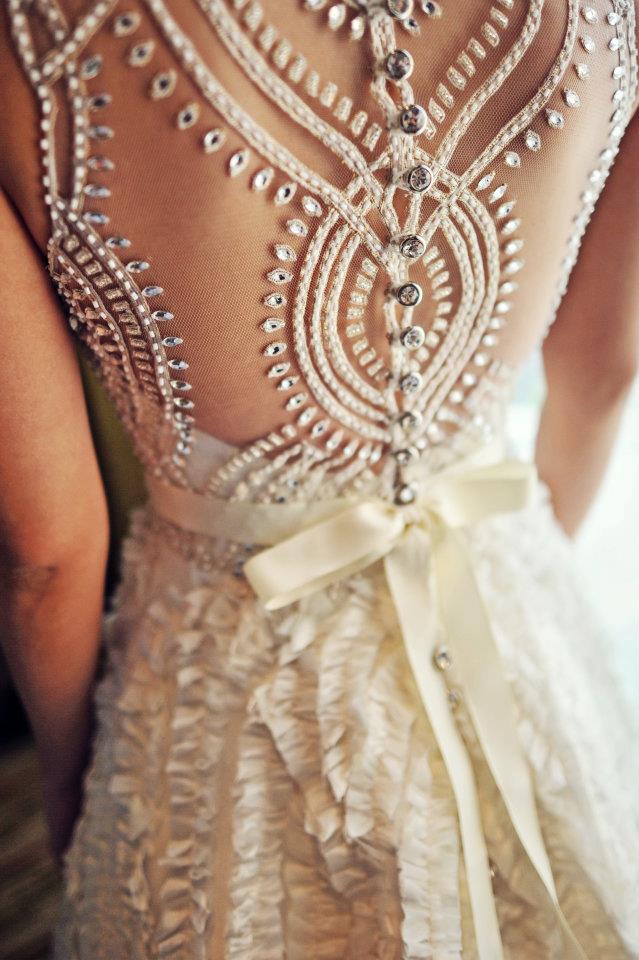 Beautiful lace detail on the back of this vintage ivory wedding dress
