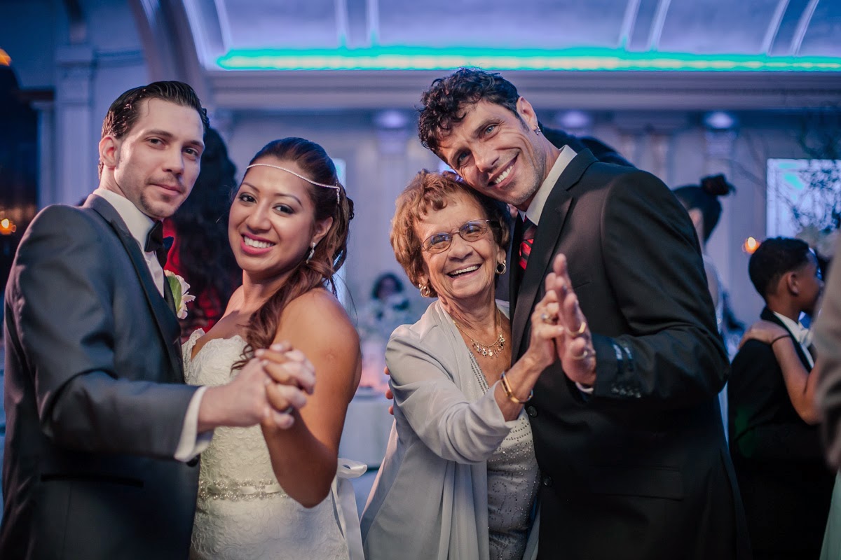 Couple Having Fun On The Dance Floor With Guests