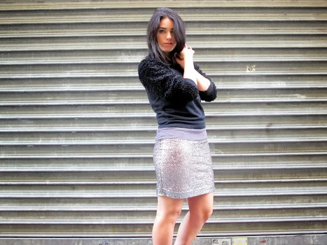 Fashion blogger Emma Louise Layla wearing Superdry silver sequin miniskirt