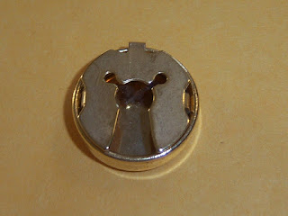 Photo of button cover back.