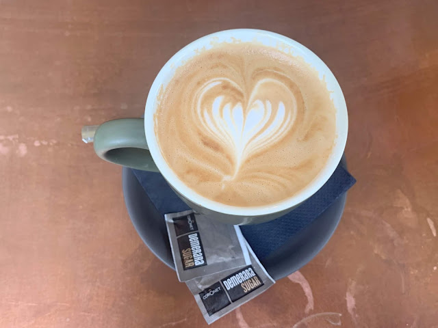 cup of coffee on a saucer on the table 