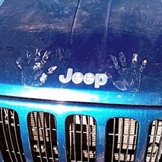 Hand prints on the Jeep