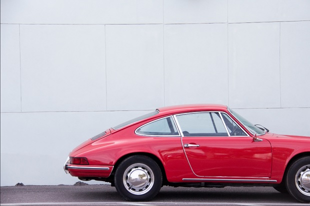 A red automobile was put on sales by the owner