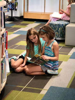 students reading in the library