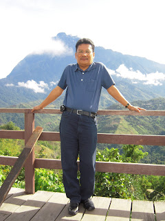 Mount Kinabalu at the back of Author