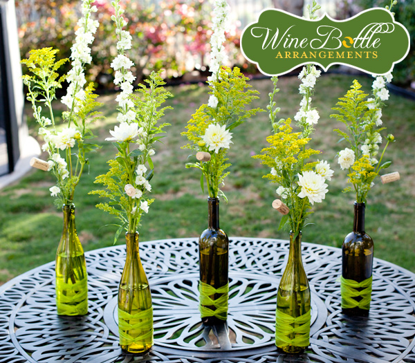 Here is a simply classy wine bottle flower centerpiece for wedding tables 