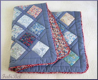 The baby boy's blanket quilted and binded