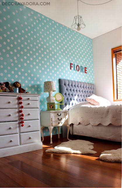 Polka dot accent blue wall in girl room