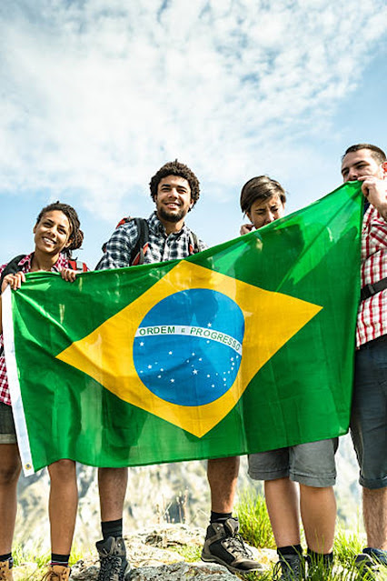 people holding the brazilian flag