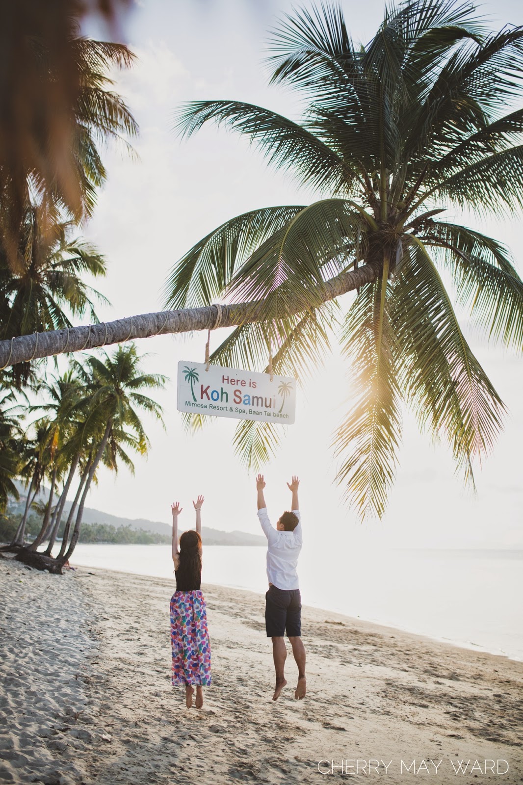 Here is Koh Samui sign, Ban Tai beach, fun engagement photos, couple jumping on the beach, Thailand
