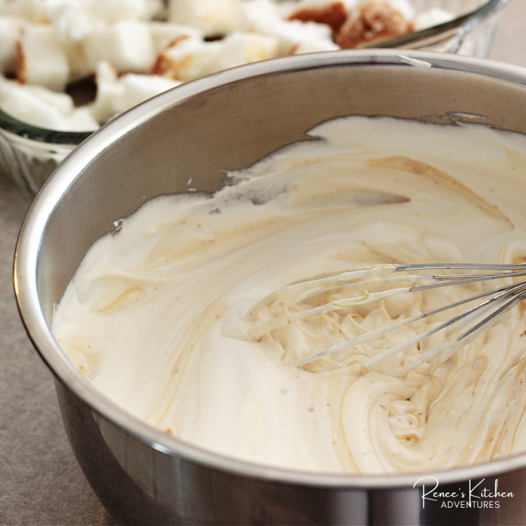Bowl and whisk with creamy filling for Easy No-Bake Butterfinger Dessert with Angel Food Cake