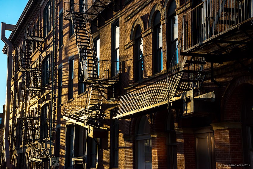 Portland, Maine USA November 2015 Photo by Corey Templeton. The morning light along upper Market Street. The reflection of the light against the fire escapes catches your eye from a distance.