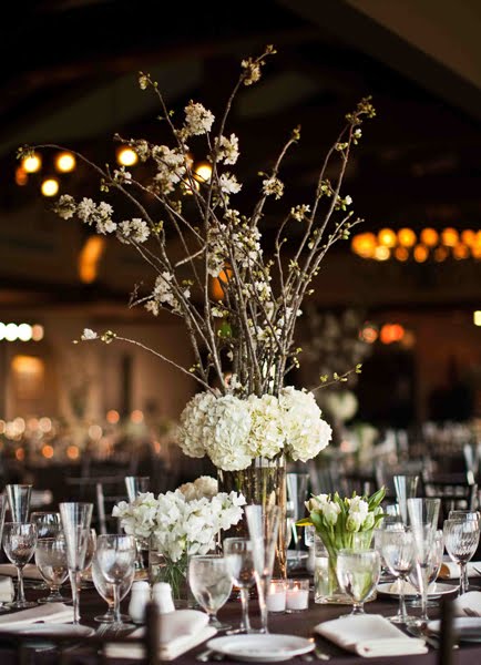 tall cherry blossom and hydrangea arrangements anchored the centerpieces on