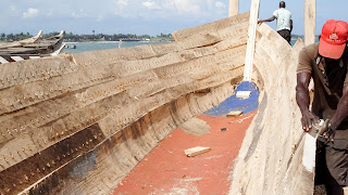 Man is crafting his own boat in Ghana