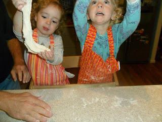 Practicing pizza throwing skills for homemade pizza recipe