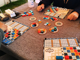 Game boards and pieces showing decorative tiles