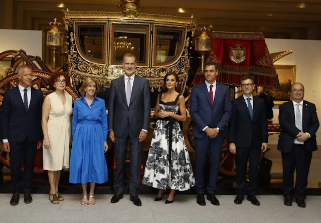 Queen Letizia wore a new floral bow a-line cocktail dress by Carolina Herrera. King Felipe and Prime Minister Pedro Sanchez