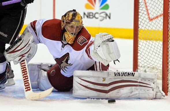 Apr 2, 2014; Los Angeles, CA, USA;   Phoenix Coyotes goalie Thomas Greiss (1) makes a save off a shot by Los Angeles Kings right wing Justin Williams (14) in the second period of the game at Staples Center. Mandatory Credit: Jayne Kamin-Oncea-USA TODAY Sports