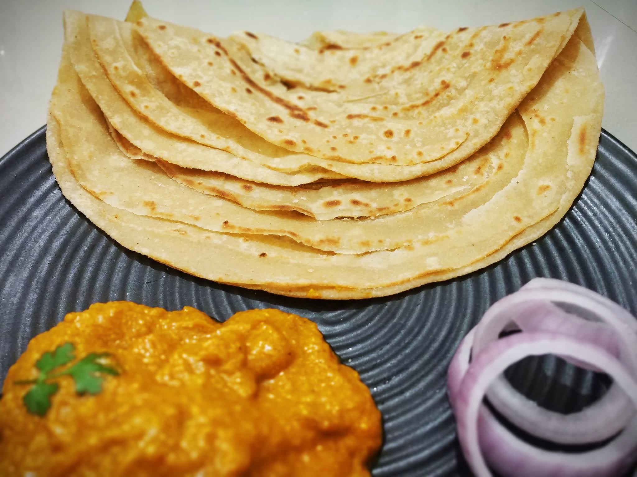 Indian Bread Lachha Paratha with curry