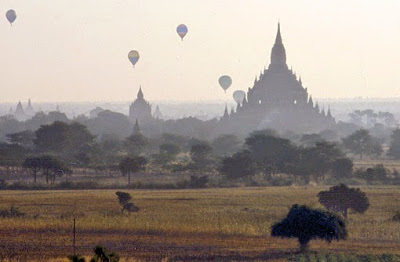 Drifting with balloons over Buddhist temples in Bagan