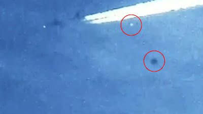 A UFO Orb is seen flying around a military Jet surveying it in 2016.