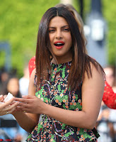 Priyanka Chopra looks super cute in happy mood wearing a short flower print dress in Hollywood 019.jpg