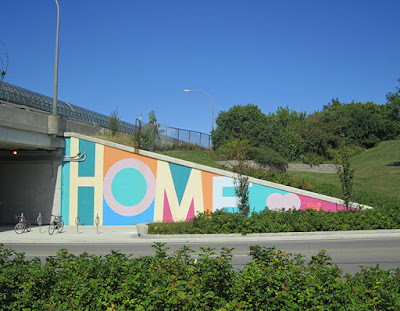 Image of a large mural featuring the word HOME, in Toronto