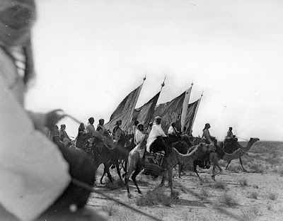 Soldiers from Ikhwan army marching on camels